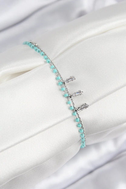 Silver women's bracelet with zircon stones and turquoise beads