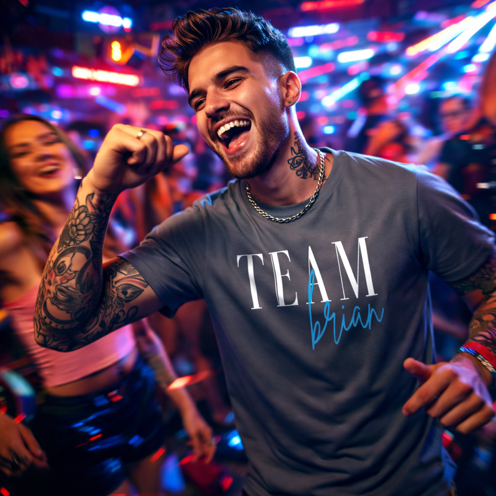 Man in a 'TEAM brian' shirt dancing in a lively, colorful setting
