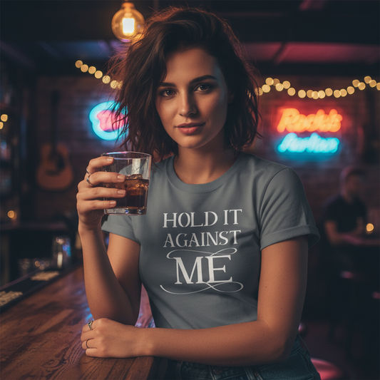 Gray t-shirt with white text 'Hold It Against Me' on a white background