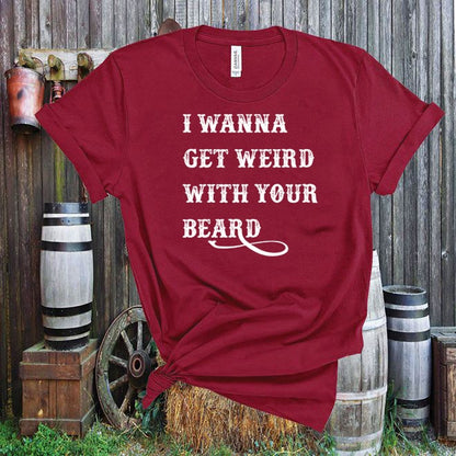 Red t-shirt with 'I Wanna Get Weird With Your Beard' text in a rustic outdoor setting.
