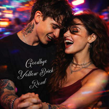 Couple laughing together with 'Goodbye Yellow Brick Road' text on a blurred city nightlife background