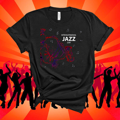 Black t-shirt with 'International Jazz Day' design on an orange background with silhouettes of people dancing.