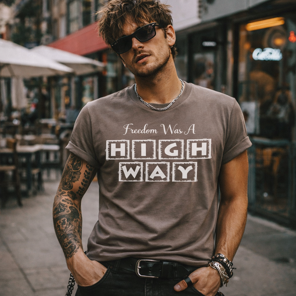 Man wearing a t-shirt with 'Freedom Was A High Way' text in an urban setting