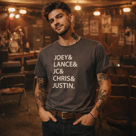 Man wearing a t-shirt with names in a bar setting