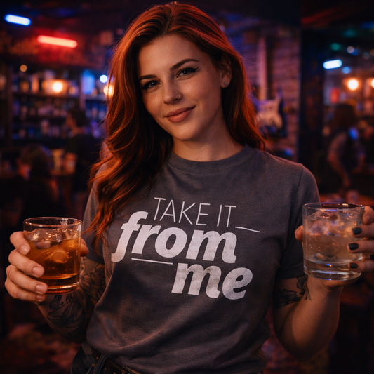 Woman wearing a t-shirt with 'Take it from me' in a bar setting