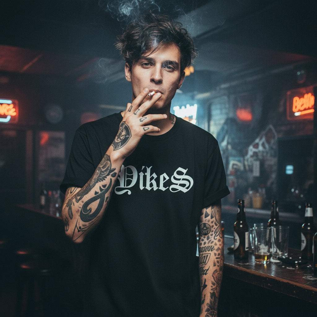 Black t-shirt with 'Dikes' printed in white against a dark, stormy sky background