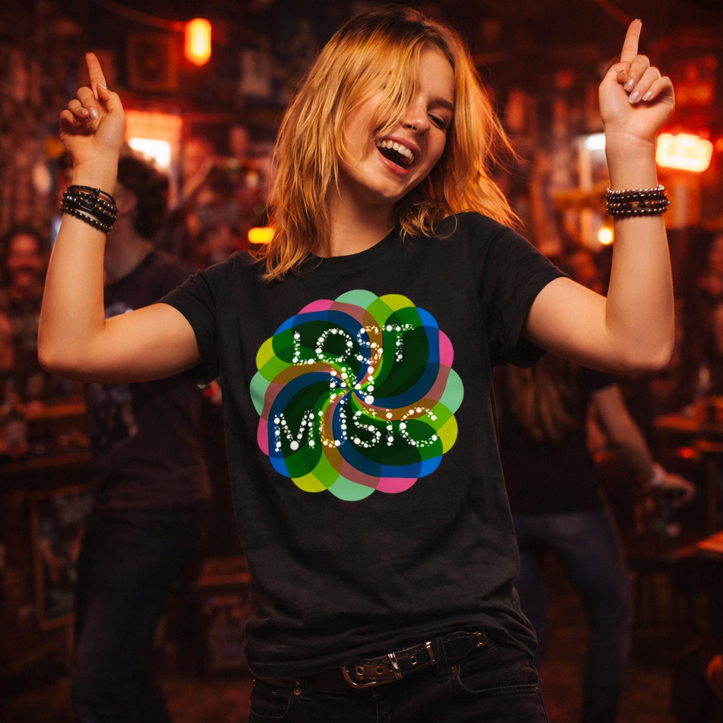Person wearing a black t-shirt with colorful design and text, dancing in a bar.