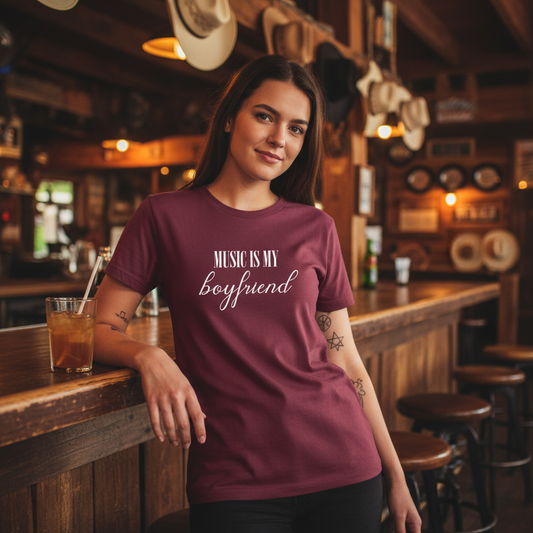 Maroon t-shirt with 'Music is my boyfriend' text on a white background