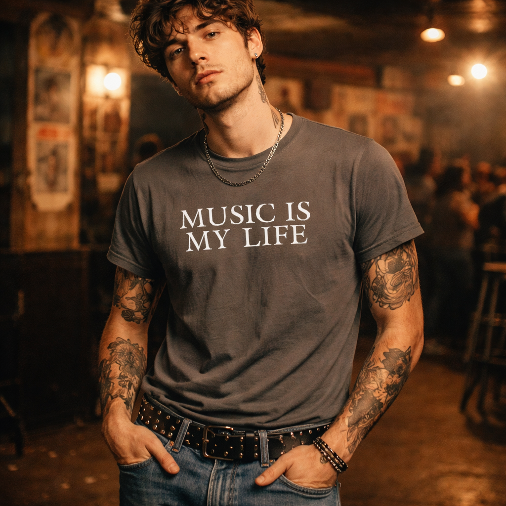 Man wearing a 'Music is My Life' t-shirt in a dimly lit room.