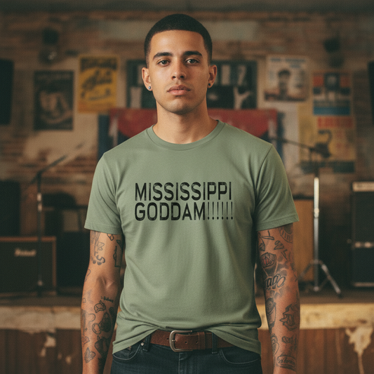 Green t-shirt with black text 'MISSISSIPPI GODDAM!!!!!!' on a white background