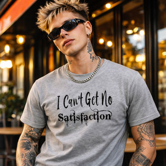 Man wearing a gray t-shirt with 'I Can't Get No Satisfaction' text in an urban setting.