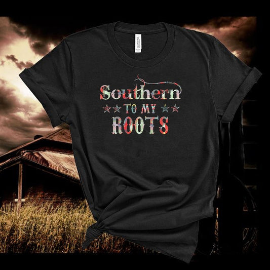 Black t-shirt with 'Southern to my Roots' text against a rustic background with a barn.