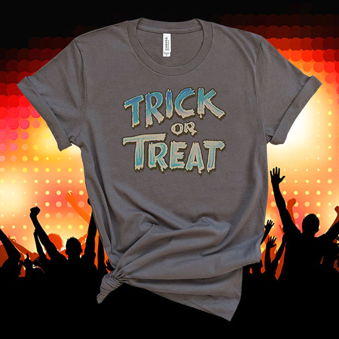 Gray t-shirt with 'Trick or Treat' text against a colorful crowd silhouette background